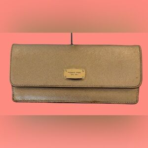 Michael Kors Gold-Tone Metallic Leather Wallet. In the Jet set Travel collection